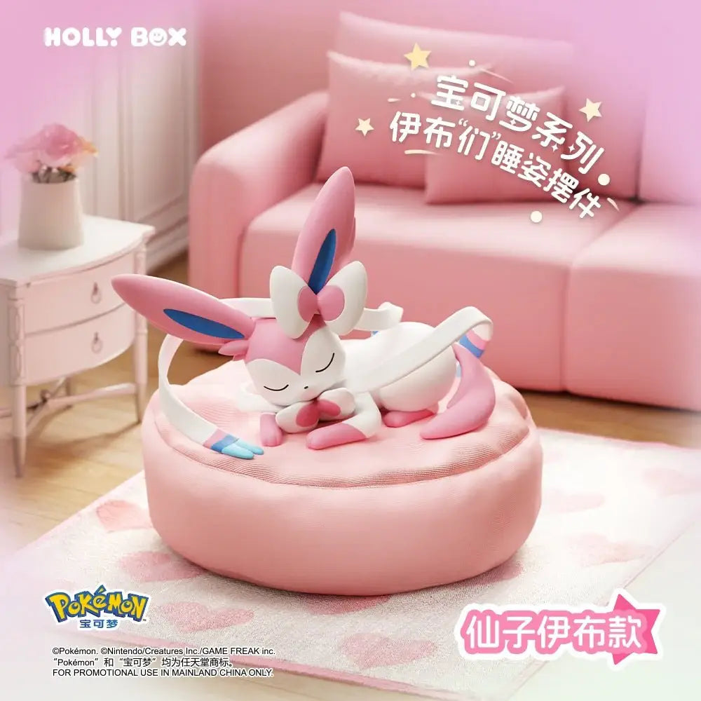 Boîte surprise Eeveelution endormie mettant en vedette Sylveon sur un coussin douillet.