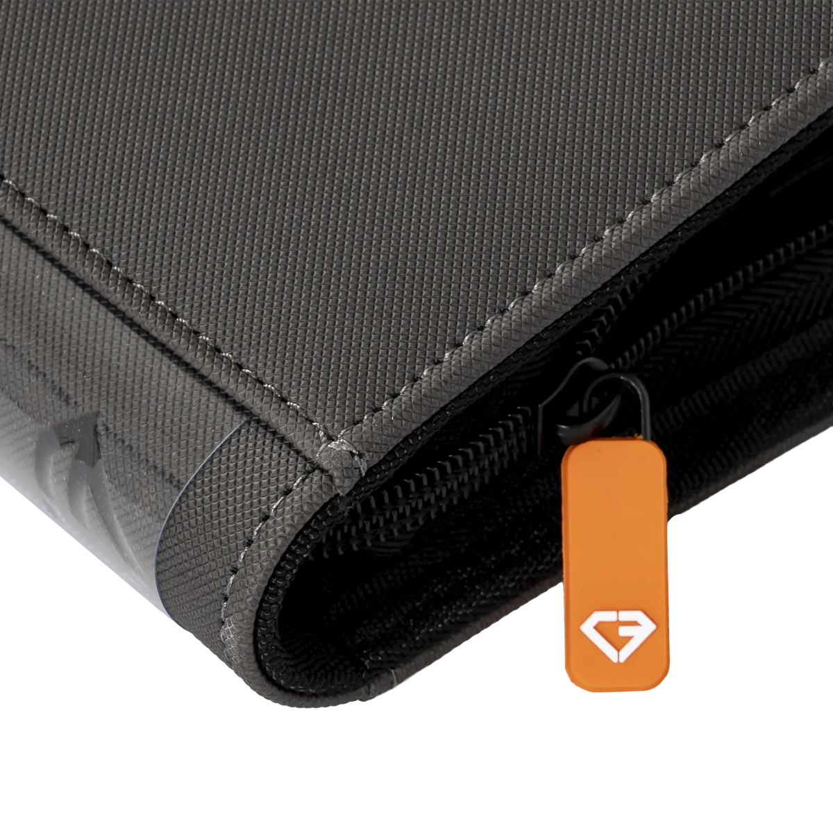 4-Pocket Card Binder Grey close-up showing durable surface, smooth zipper, and branding tag.