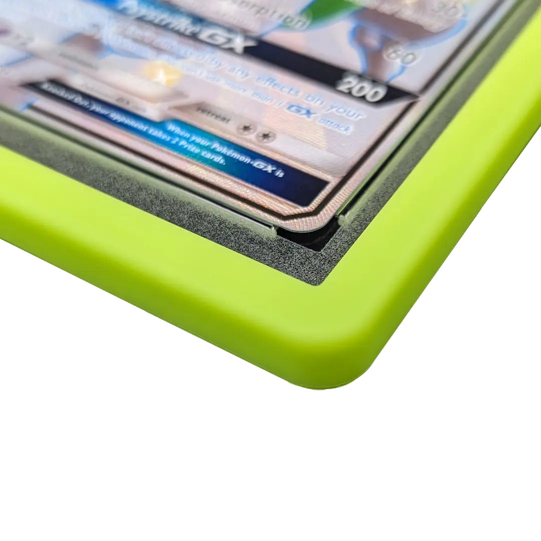 PSA Slab Bumper - Light green showcasing a premium silicone edge around a graded card slab.