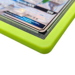 PSA Slab Bumper - Light green showcasing a premium silicone edge around a graded card slab.