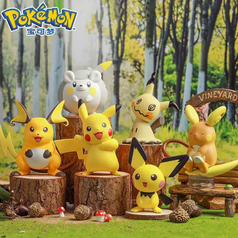 Togedemaru Figure among various Pokémon figures on tree stumps in a forest setting.