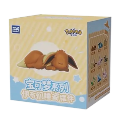 Boîte surprise "Eeveelution endormie" avec une figurine Evoli endormi et un design assorti.
