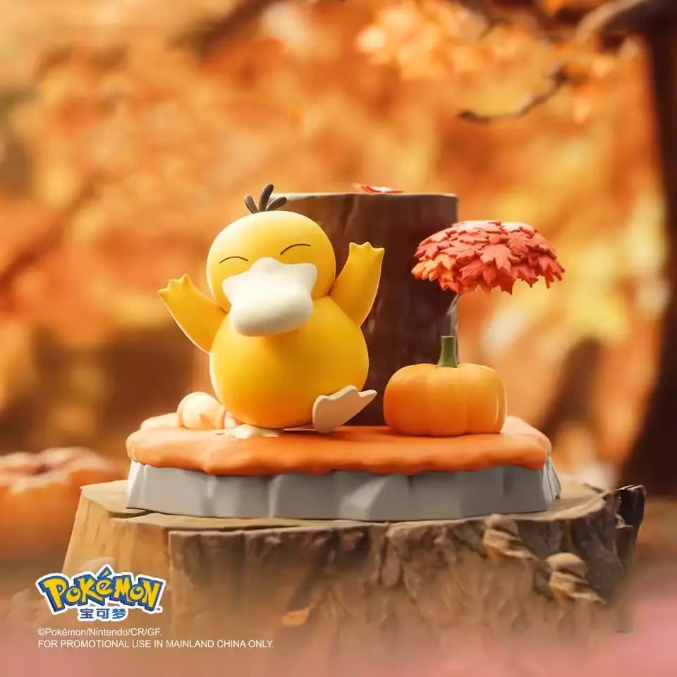 Psyduck Pokémon Nature Figure sitting on a stump with an autumn backdrop and pumpkin decoration.