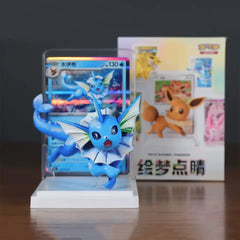 Pokémon Eeveelutions Blind Box [Live] featuring Vaporeon figurine and Eevee card in backdrop.